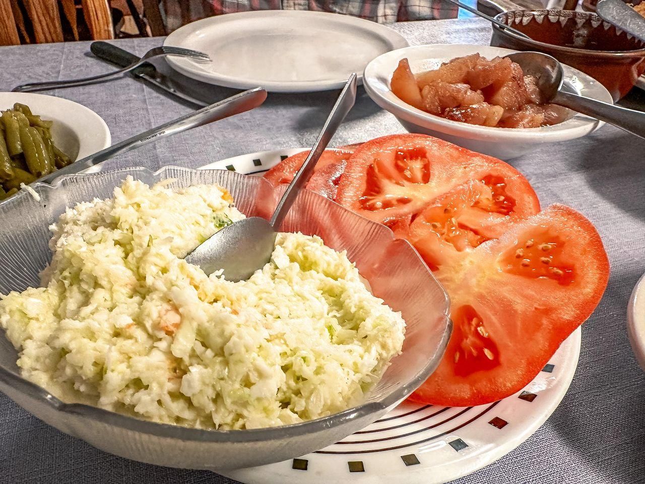 Cole slaw and sliced tomatoes at The Lighthouse Restaurant at Sulphur Well, Kentucky