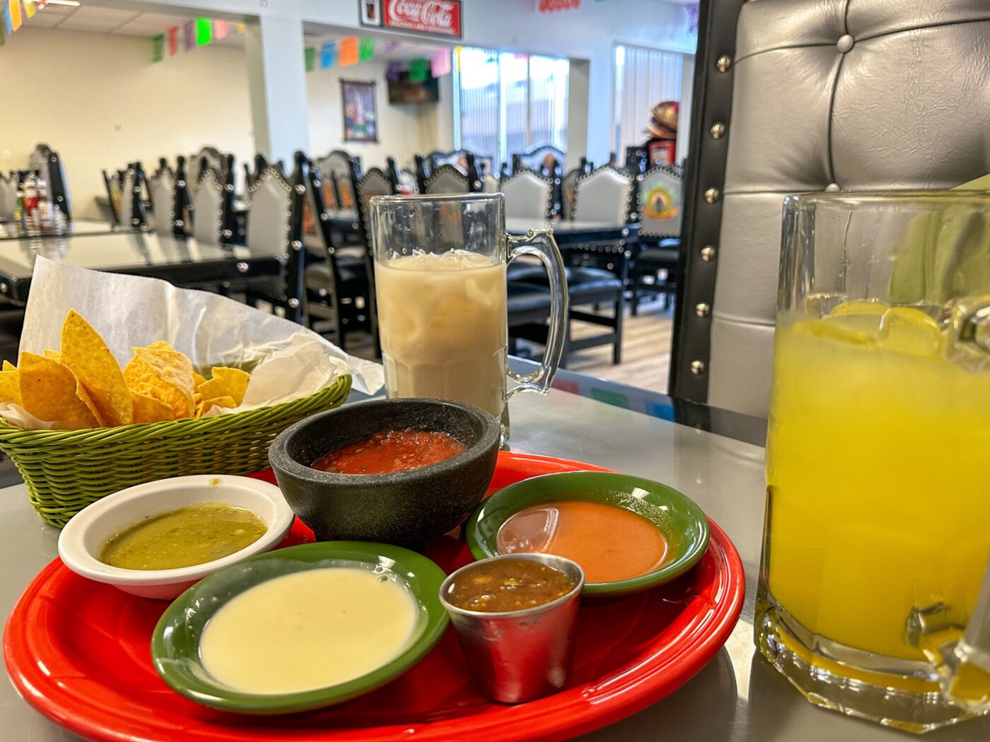 Chips and salsa, pineapple water, and horchata at Rey Azteca in Liberty, Kentucky