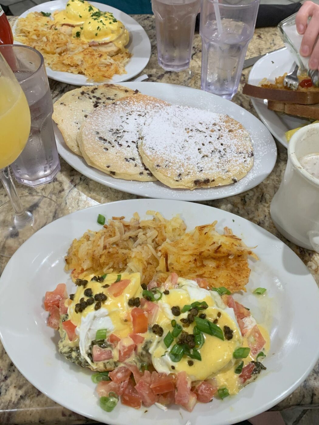 Eggs Benedict and chocolate chip pancakes at Ruby Slipper Cafe in New Orleans