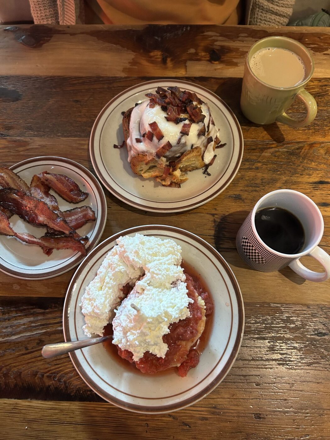 Strawberry Shortcake, Giant Biscuit Cinnamon Roll, and bacon at the Denver Biscuit Company in Colorado Springs