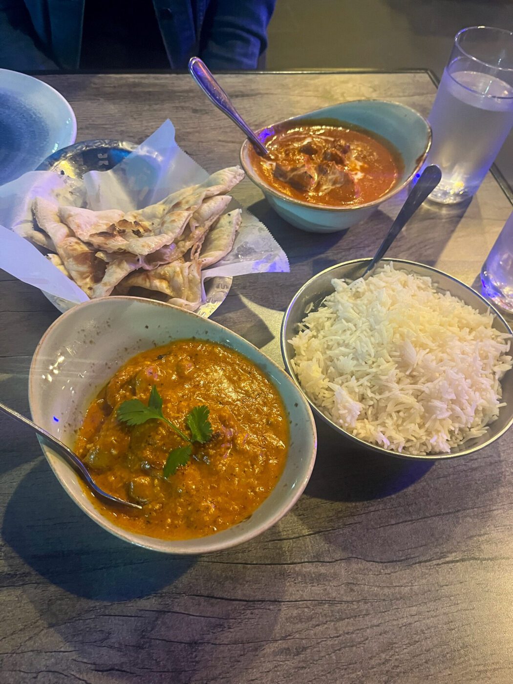 Cashew chicken, chicken tikka masala, and butter naan at Namaste Bar & Grill, Santa Cruz, California
